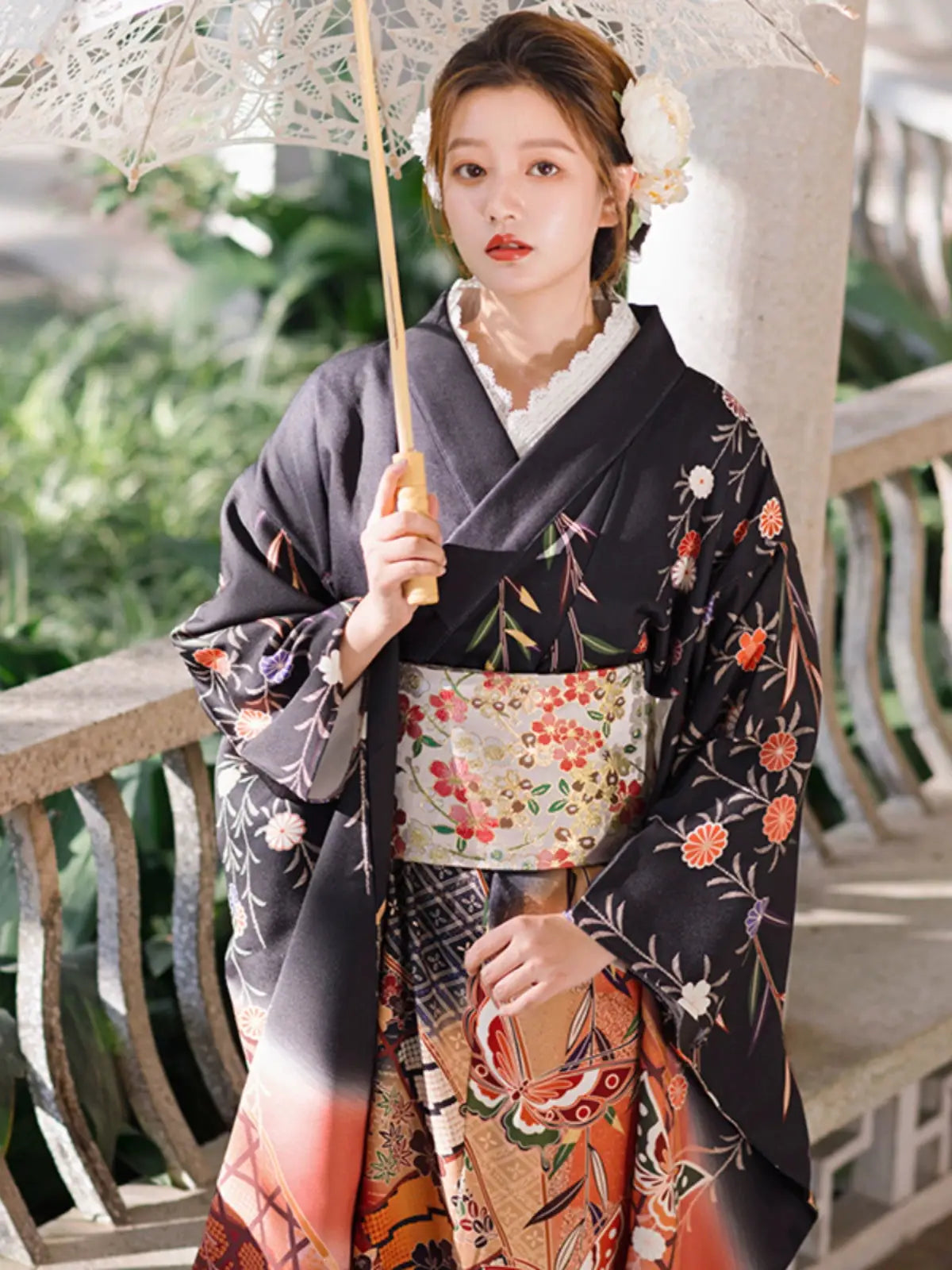 Retro Japanese kimono with intricate butterfly and floral designs, styled with a parasol.