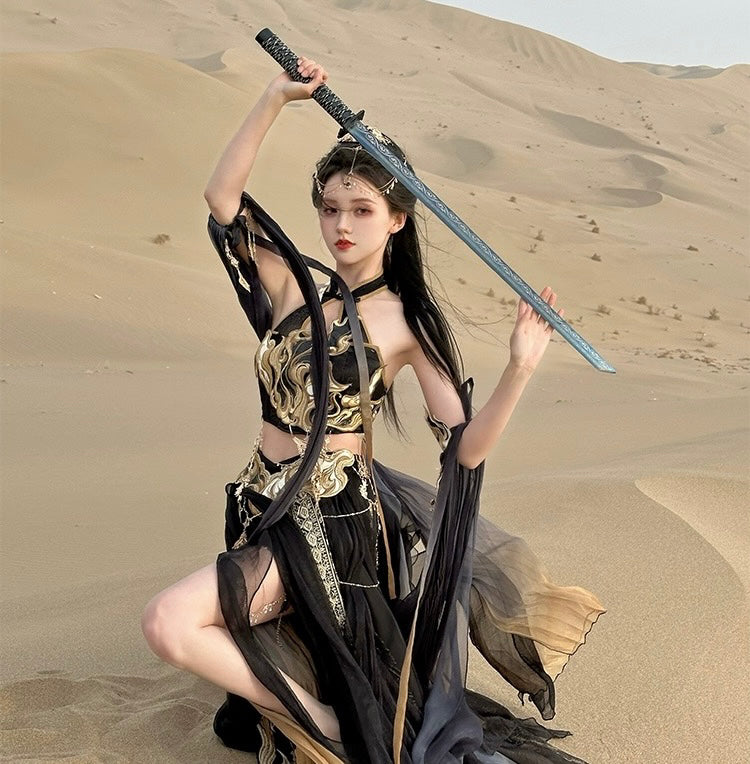 Desert warrior pose in Sacred Flame Western Regions Dancer Hanfu, black and gold exotic style with sword and flowing chiffon sleeves.