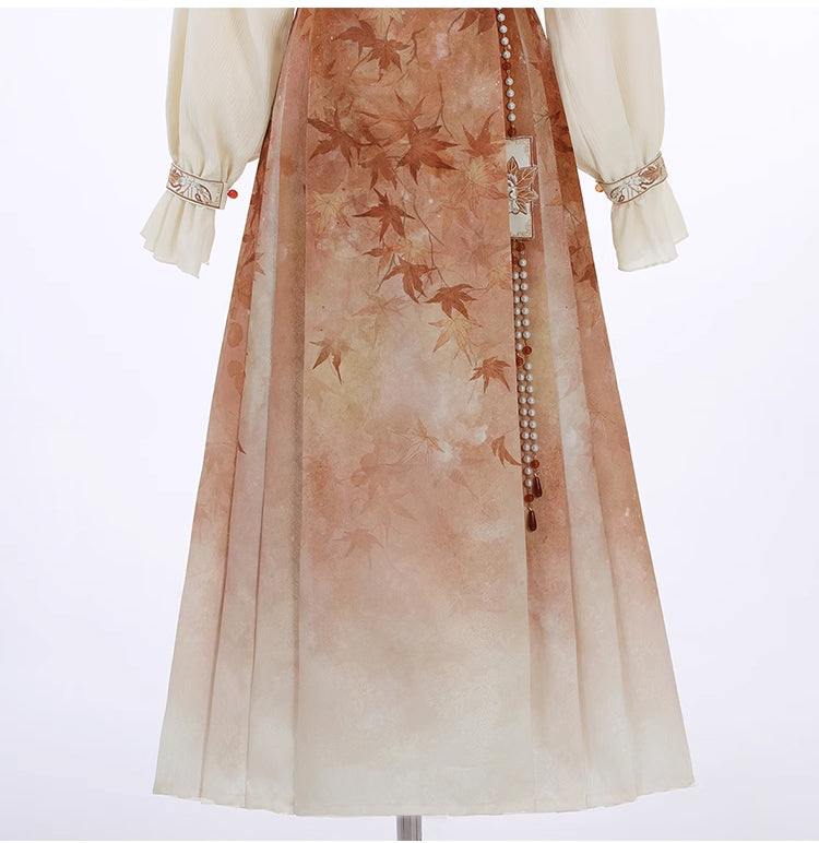 Close-up of pleated skirt with maple leaf print from the Maple Leaf Hanfu Women's New Chinese Style set.