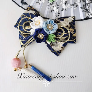Navy blue Japanese kimono hair accessory with white and blue cherry blossoms and tassels, perfect for elegant traditional wear.