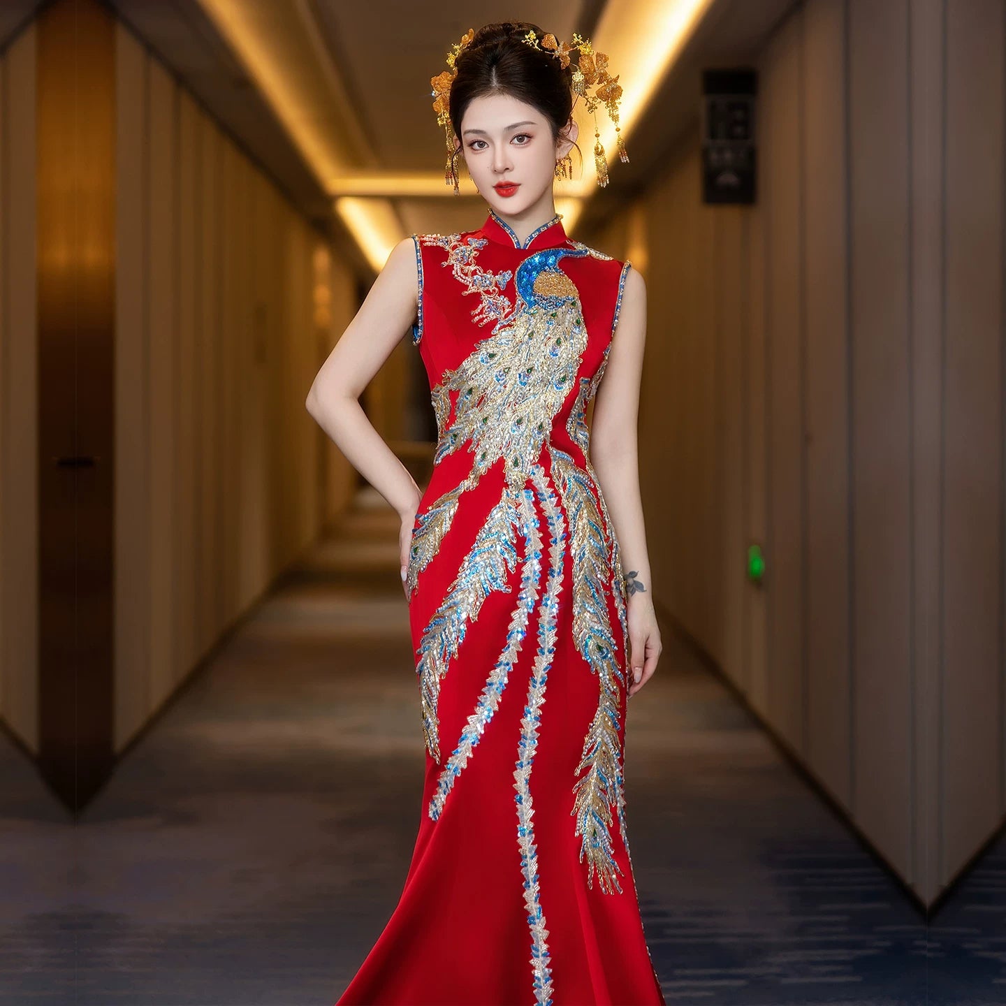Red luxury bridal qipao with dragon phoenix embroidery close-up