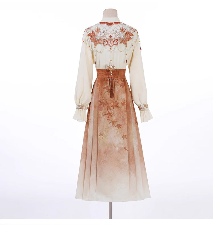 Rear mannequin view of Maple Leaf Hanfu showing detailed embroidery and pleated skirt with soft gradient tones.