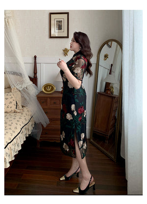 Side view of black floral embroidered plus size cheongsam with lace, highlighting the dress's silhouette and slit detail.