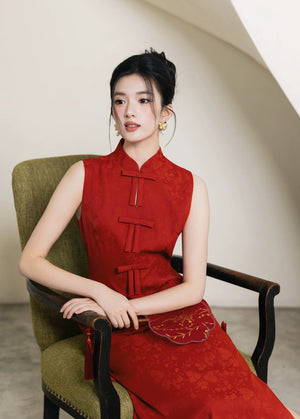 Seated three-quarter portrait of vermilion red wedding cheongsam
