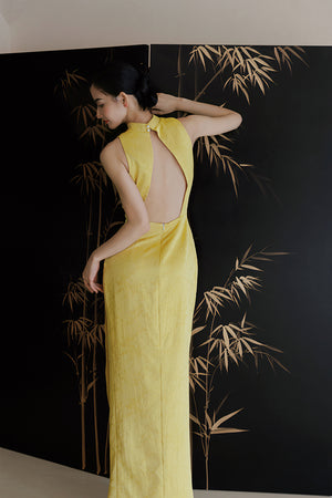Back view of Yellow Cheongsam Wedding Dress showing keyhole design, ideal for elegant bridal styling.