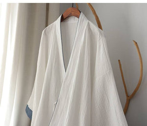 Upper section of Chinese style white Hanfu robe showing soft cotton weave and classic neckline for luxurious loungewear.