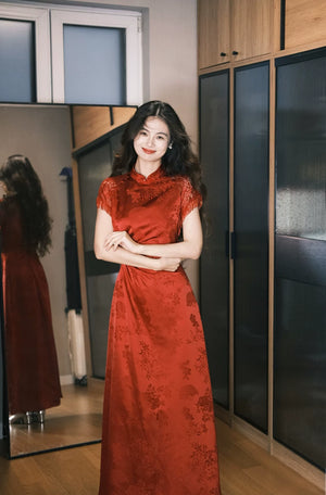 Front view of red jacquard bridal cheongsam in mirror-lined interior