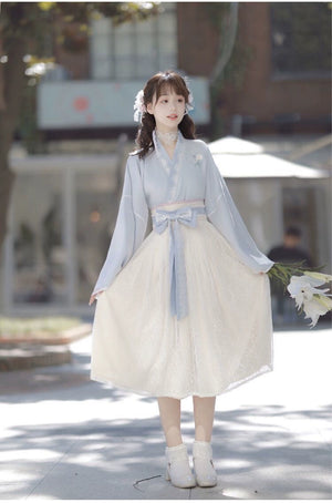 Blue Modern Hanfu Dress with lace skirt and embroidered flower detail, perfect for spring fashion and traditional wear.
