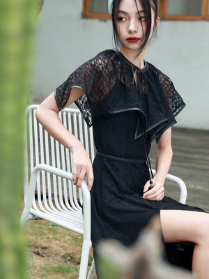 Close-up of Dark Gothic Shawl Women's Summer Vintage Irregular Lace Short Cloak with sheer lace and PU trim, worn over a black slit dress.