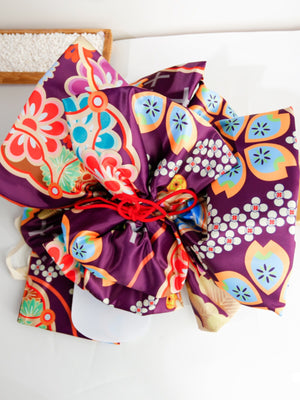 Purple kimono belt with colorful floral big three-leaf bow design. Geisha-inspired accessory perfect for traditional kimono styling.