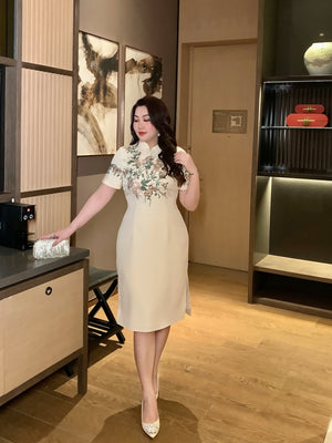 Champagne embroidered plus size qipao dress with short sleeves and floral design, ideal for weddings or festive occasions.