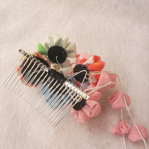 Back view of Japanese crepe floral hair comb showing metal teeth and fabric flower construction, designed for kimono and Hanfu wear.