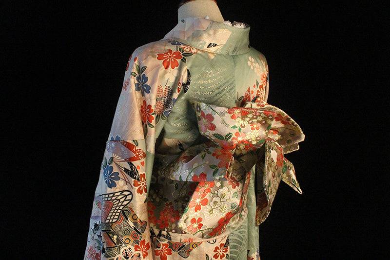 Side view of Brocade Premium Styling Bow Waist Seal on pastel kimono, showcasing elegant floral brocade design for kimono accessories.