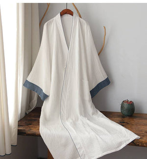 Elegant Chinese style white Hanfu robe displayed on wooden bench, perfect for homewear or cotton pajamas with traditional flair.