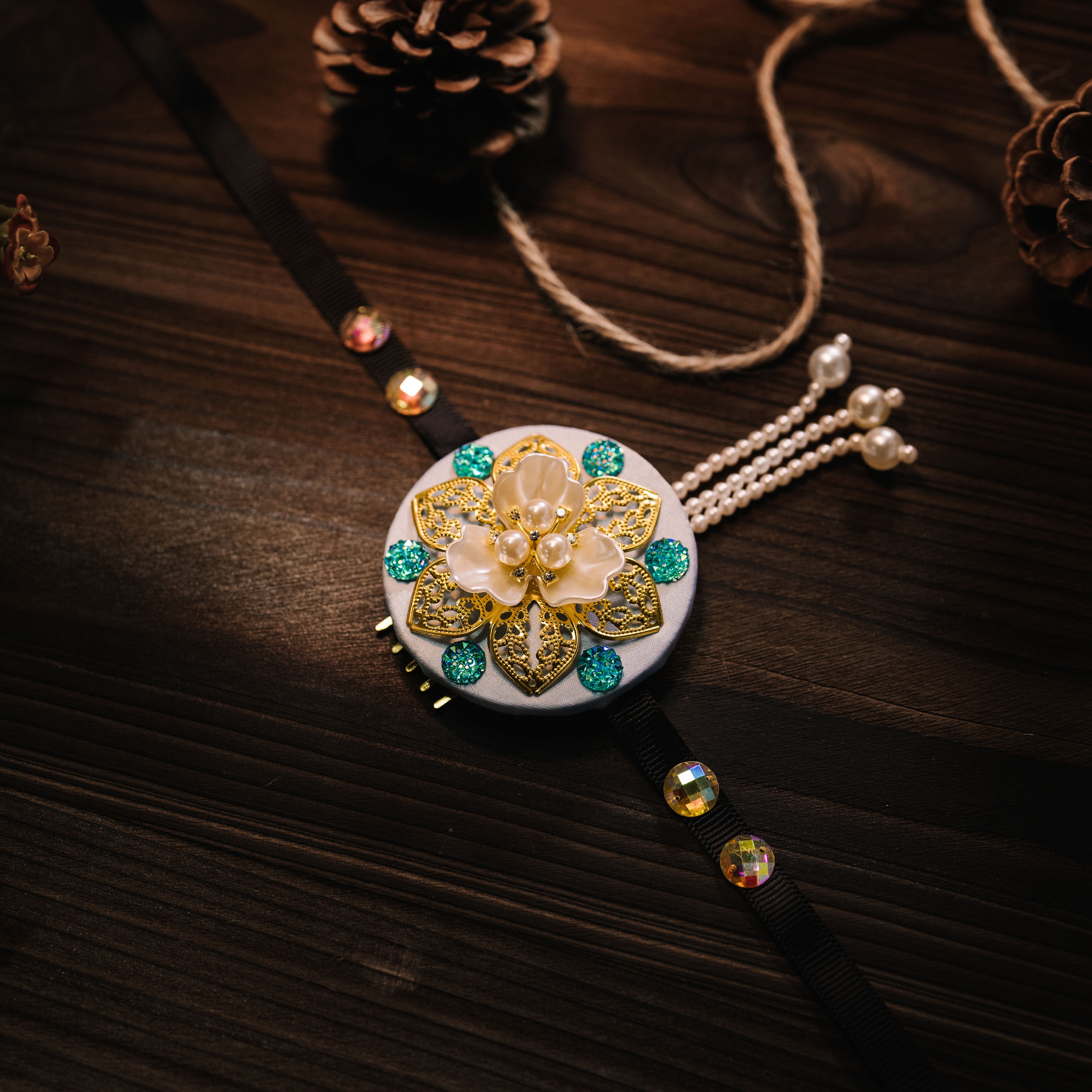Elegant Korean traditional ethnic headgear with turquoise gems and gold floral centerpiece, ideal for cultural hair styling.