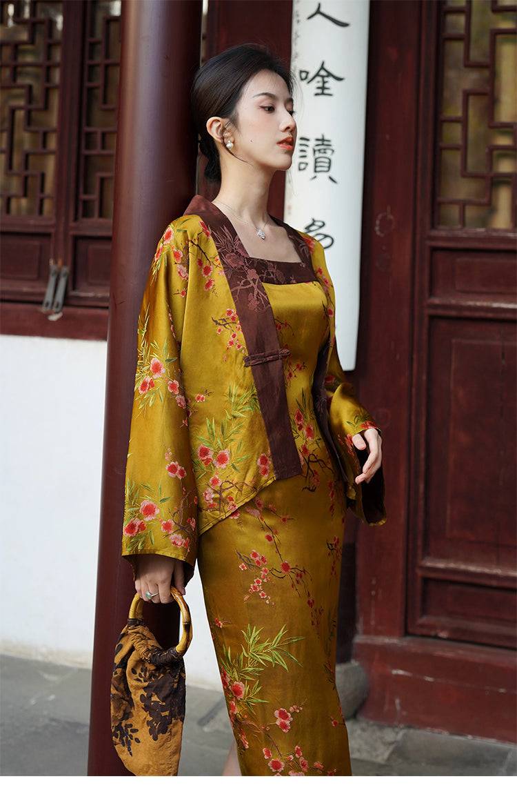 Women's Golden Jelly Dress Set with high-end jacquard fabric and floral design, paired with a brown velvet handbag in a traditional setting.