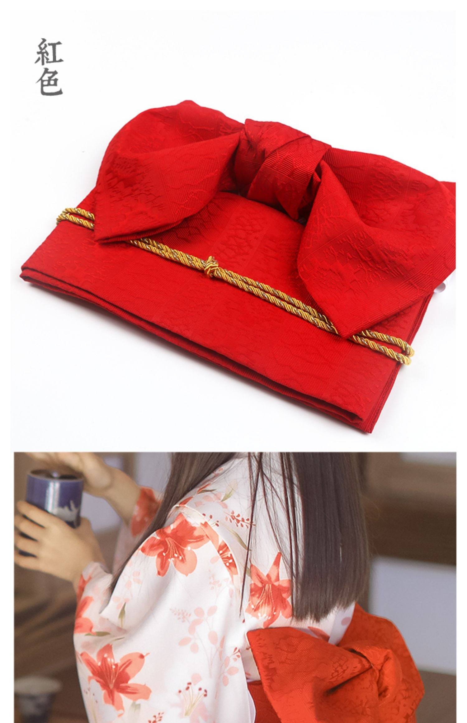 Red brocade bow belt with gold cord, styled with floral yukata for traditional Japanese kimono waist seal and festive styling.