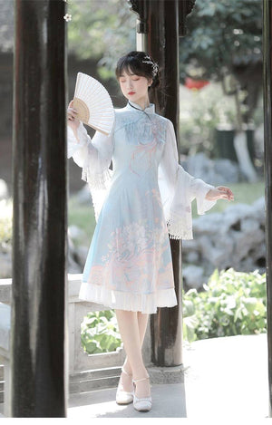 Graceful blue Feihua Hanfu Cheongsam Dress with fan accessory, ideal for women embracing New Chinese style fashion.
