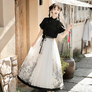 Model twirling in modern Hanfu black top and floral print skirt set, styled for spring and summer elegance.