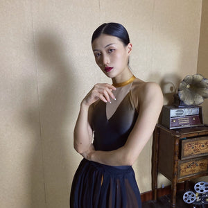 Forbidden Spring luxury Chinese-style halter top with gold choker and flowing dark skirt