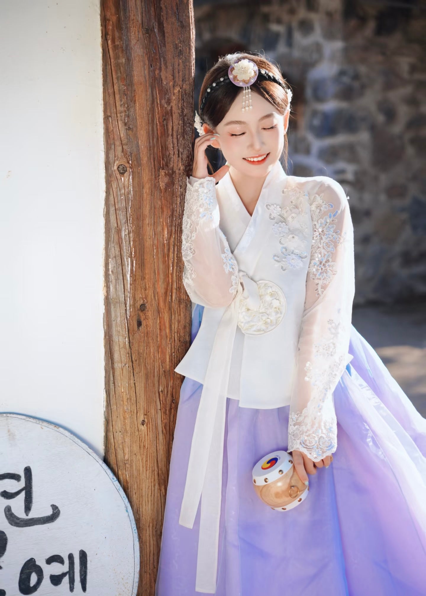 White purple Korean female high-end genuine Yanji court hanbok with embroidered top and purple skirt, model holding traditional drum.