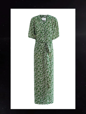 Elegant green ethnic dress with soft chiffon drape and summer styling