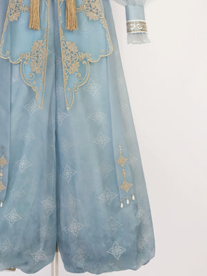 Close-up of pants from blue Hanfu Princess Jasmine suit by 【Cloud Traveler】, showing gold embroidery and ethnic motifs.