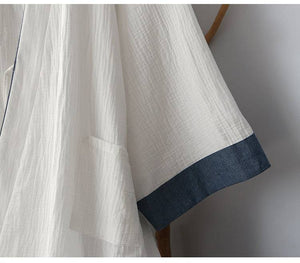 Pocket and sleeve detail of Chinese style white Hanfu robe with blue trim, emphasizing comfort and traditional design.