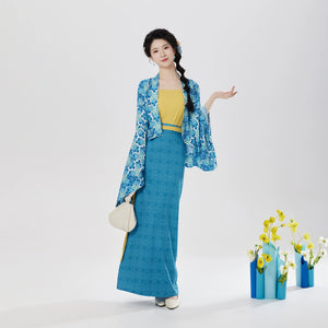 Modern blue resort hanfu three-piece set with yellow camisole, model posing