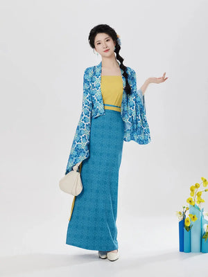 Modern blue floral hanfu set with yellow camisole and blue skirt, straw hat, cream handbag