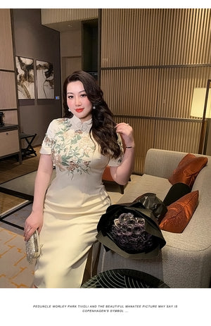Stylish plus size long qipao with champagne floral embroidery, combining traditional Chinese design with modern elegance.