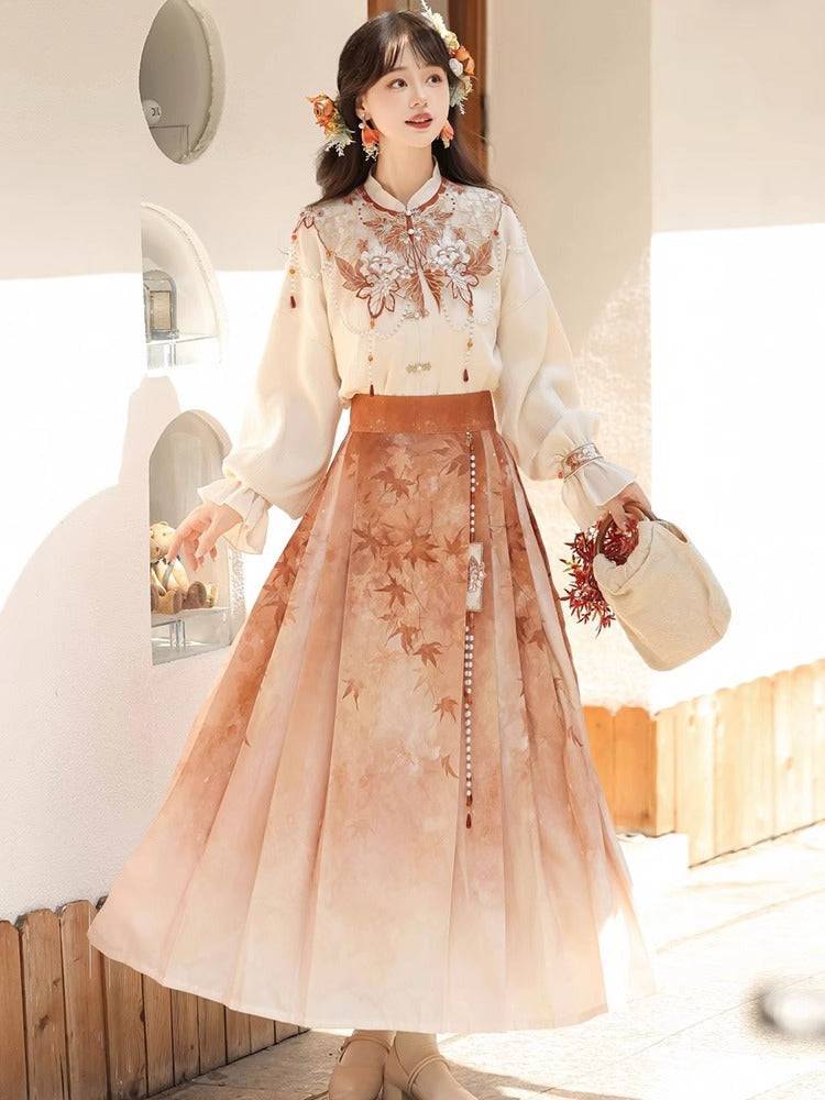 Maple Leaf Hanfu Women's New Chinese Style Daily Han Element Cloud Shoulder Top and Three-pleated Skirt Set in soft beige and maple tones.