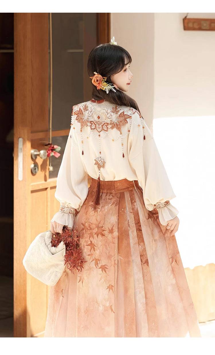 Back design of Maple Leaf Hanfu showing intricate embroidery and tassel details on the cloud shoulder top.
