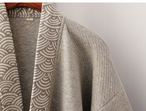 Shoulder and collar close-up of Chinese style gray Hanfu loungewear, highlighting quality stitching and wave-pattern design.