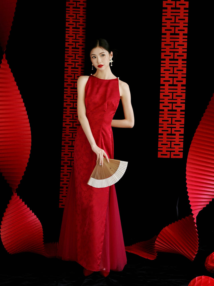 Red yarn cheongsam bridal dress with fan, styled for traditional wedding or engagement celebrations.