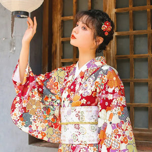 Close-up of a Japanese retro kimono with a white obi, showcasing intricate floral designs. A perfect blend of tradition and elegance.