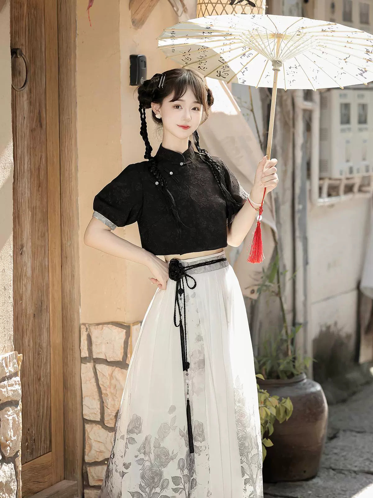 Chic Chinese style black top and printed white skirt set with tassel belt, perfect for spring and summer fashion.