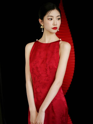 Close-up of red yarn cheongsam dress with floral embroidery, perfect for bridal wedding or engagement events.