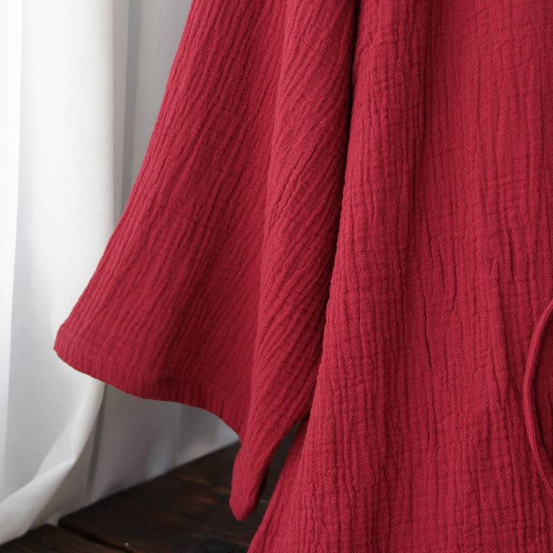 Detailed sleeve view of the red Hanfu-style Zen robe, highlighting the soft, textured pure cotton material perfect for summer wear.