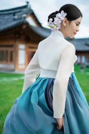 Side view of Blue Hanbok 2025 new princess palace wedding clothing with elegant silhouette and traditional Korean styling.