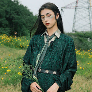 Elevate your style with our Tang Dynasty-inspired Round Collar Robe Hanfu. Crafted with attention to detail, this modern interpretation features a stylish round collar and half-arm design, perfect for men and women alike. Explore the timeless charm of ancient Chinese fashion with our green Hanfu ensemble.