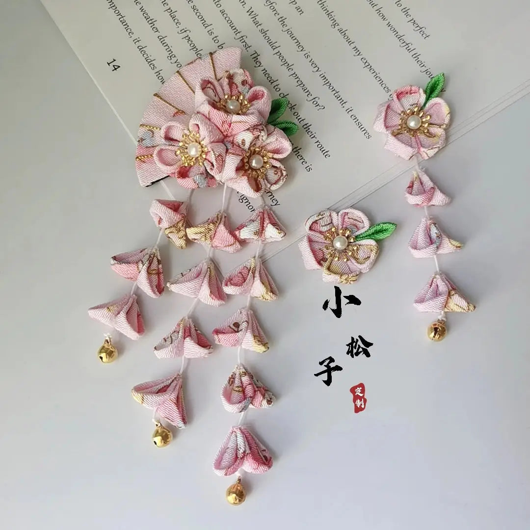 Light pink Japanese kimono hair accessory set with floral fan design and tassels, featuring gold accents and pearl centers.