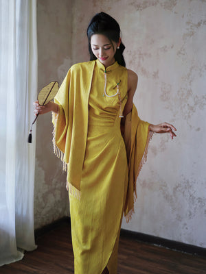 Close-up of pearl and jade embellishments on yellow Cheongsam bridal dress, showcasing luxury details.