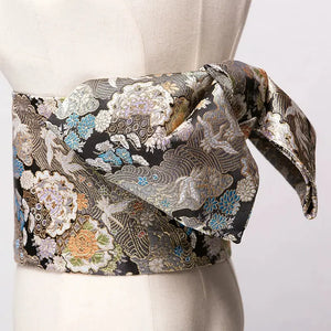 Black and gold brocade Yukata bow belt with intricate floral embroidery. A striking kimono waist belt for an elegant appearance.