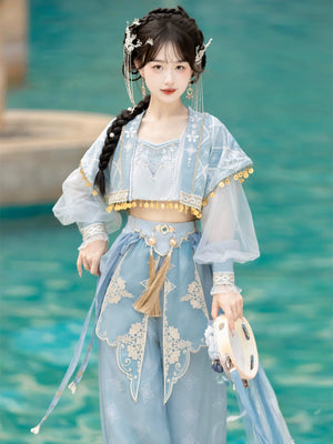 Close-up of the blue Hanfu Princess Jasmine outfit by 【Cloud Traveler】, highlighting gold coin trim and detailed embroidery.