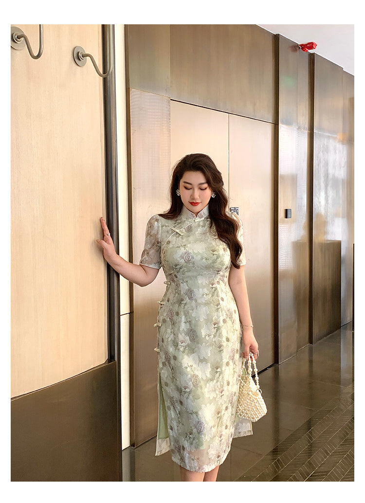 Modern Chinese green plus size cheongsam with delicate floral embroidery and side frog buttons, styled for a refined fashion look.