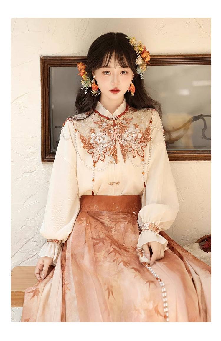 Close-up of embroidered top in Maple Leaf Hanfu set, highlighting floral and bead detailing for a refined spring look.