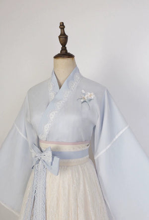 Mannequin display of Blue Modern Hanfu Dress with lace skirt and embroidered flower, ideal for showcasing spring fashion details.