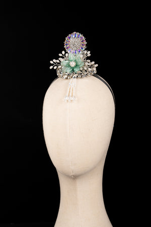 Side view of Korean traditional ethnic headgear on mannequin, highlighting floral and jeweled design for Korean princess hair accessories.