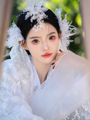 Close-up of White&Pink hanbok Korean dress showcasing intricate lace and floral accessories, ideal for high-end performance attire.